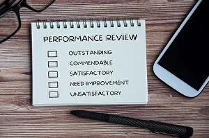 Performance Appraisal Checklist Prints: Performance appraisal checklist on notepad with with office setting background