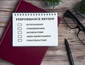 Performance Appraisal Checklist Prints: Performance appraisal checklist on notepad with with office setting background