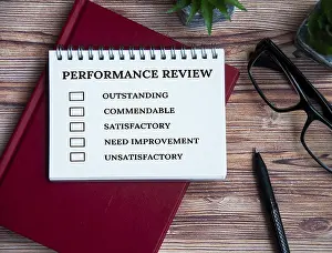 Performance Appraisal Checklist Prints: Performance appraisal checklist on notepad with with office setting background
