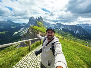 UNESCO World Heritage Site Alps Prints: Photographer with backpack