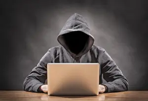 Computer Hacking Risks Prints: picture of a hacker on a computer