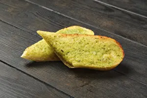 Garlic Bread Prints: Two pieces of garlic bread on a table