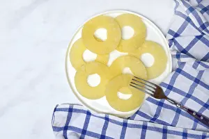 Exotic Food Still Life Prints: Pineapple rings on plate with fork