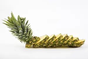 Bright Background Food Images Prints: Pineapple with slices on a white background