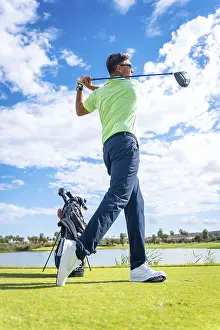 Golf Course Landscape Prints: A player playing golf on the golf course