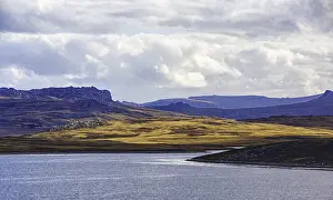 Cloudy Mountain Scenery Prints: Playing light over mountains and water with dramatic clouds in the background