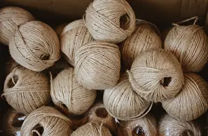 Linen Cord Rolls Prints: Plenty of spools or rolls of brown color linen string