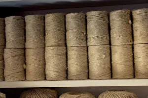 Linen Cord Rolls Prints: Plenty of spools or rolls of brown color linen string