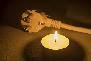 Electricity Supply Infrastructure Prints: A plug is next to a burning candle