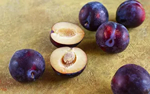 Fresh Plums Prints: Plums scattered on the table, fresh