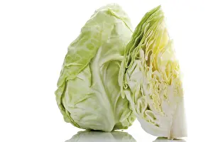 Studio Shot Of Vegetables Prints: Pointed cabbage, whole and quartered head