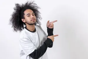 White Studio Background Picture Prints: Pointing to the right at a copy paste space