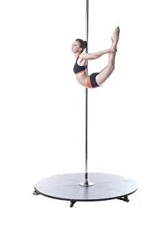 Pole Dance Prints: Pole dance. Image of pretty girl performs complex element