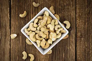 Shallow Depth Of Field Nuts Prints: Portion of Cashew Nuts (close up shot)