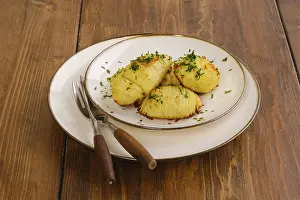 Deserted Plate Setting Prints: Portion of crispy hasselback potato on a plate