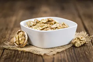 Deciduous Tree Nuts Prints: Portion of fresh Walnut kernels (close-up shot)
