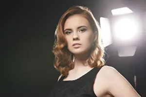 Sensual Female Portrait Photography Prints: Portrait of beautiful model posing in studio on background of spotlight