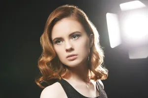 Sensual Female Head Shot Prints: Portrait of beautiful model posing in studio on background of spotlight