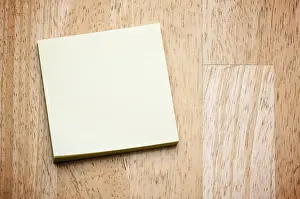Memory Aid Prints: Post it note pad on a wood background