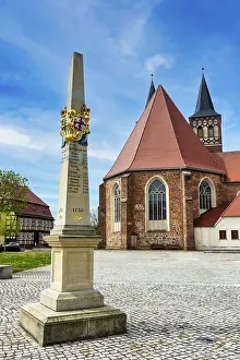 Eastern Germany Landmarks Prints: Postal milestone column in front of St