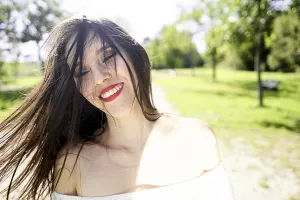 Young Woman Smiling At Camera Prints: Easygoing ease
