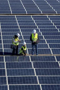 Solar Panel Inspection Prints: Engineers are inspecting a large solar panel array