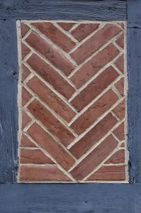Half Timbered Construction Europe Prints: Herringbone pattern in brick, brick-lined compartment on a historic half-timbered house in the old town of Quedlinburg