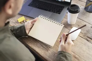 Top Down Perspective Prints: High angle freelancer taking notes