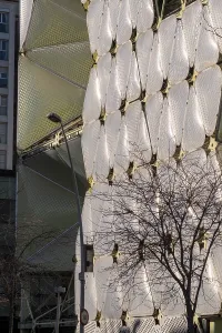 Modern Building Facade Prints: Modern building facade with white geometric patterns and exposed structural elements