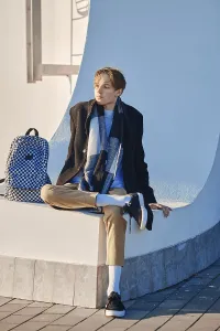 Fashionable Young Man Prints: Young student with backpack in old wool coat