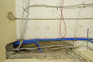 Construction Site Germany Prints: Power cables, empty conduits and network cables under the ceiling