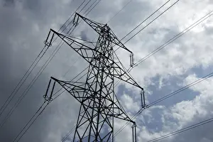 High Voltage Power Pole Prints: Power pole in front of a cloudy sky