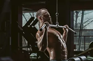 Fitness Athlete Prints: Professional athlete performs an exercise in the gym