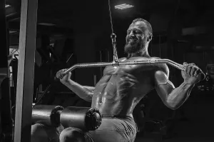 Male Athletic Physique Prints: Professional athlete performs an exercise in the gym
