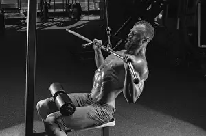 Fitness Exercise Prints: Professional athlete performs an exercise in the gym