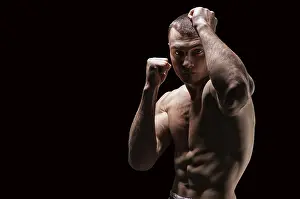 Studio Shot Of A Boxer Prints: Professional boxer posing in the studio