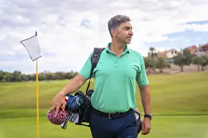 One Person Golfing Prints: A professional golf player on a golf course