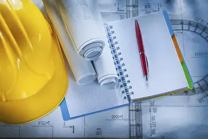 Construction Plan Blueprint Prints: Protective hard hat checked notebook pen blueprints on construction plan