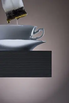 Indoor Food Photography Prints: Pulling teabag from a cup of tea