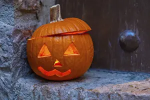Halloween Decoration Ideas Prints: A pumpkin with a hole in it and a light inside