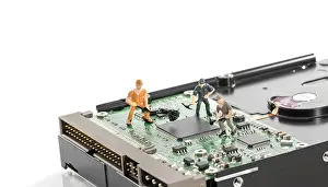 Computer Hardware Repair Prints: Puppets busy with hardware computer elements repair or format harddisk