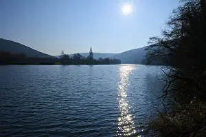 Clear Blue Sky Scenery Prints: A quiet river on which the sun is reflected