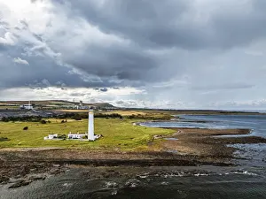 Uninhabited Scottish Coastline Prints: Rain Clouds over Barns Ness Lighthouse from a drone