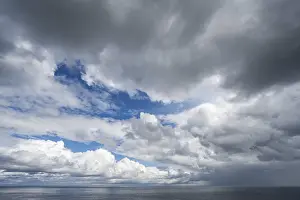 Deserted North Sea Coastline Prints: Rain clouds over the North Sea