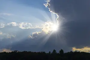 Wooded Landscape Photo Prints: Rain clouds with sun shining through
