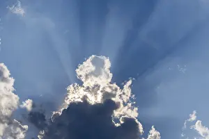 Overcast Sky With Sunlight Prints: Rain clouds with sun shining through