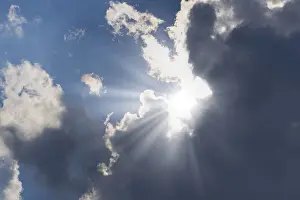 Overcast Blue Skies Prints: Rain clouds with sun shining through