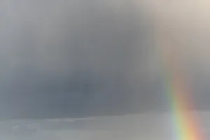 Rainbow In Rain Clouds Prints: Rainbow appears in rain clouds in spring