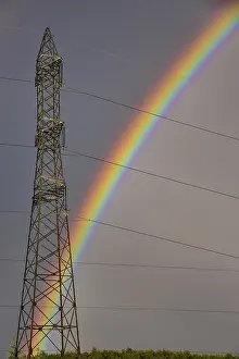 Rainbow In Europe Prints: Rainbow behind a high-voltage pylon