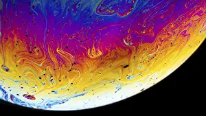 Deserted Interior Space Photo Prints: Rainbow soap bubble on a dark background